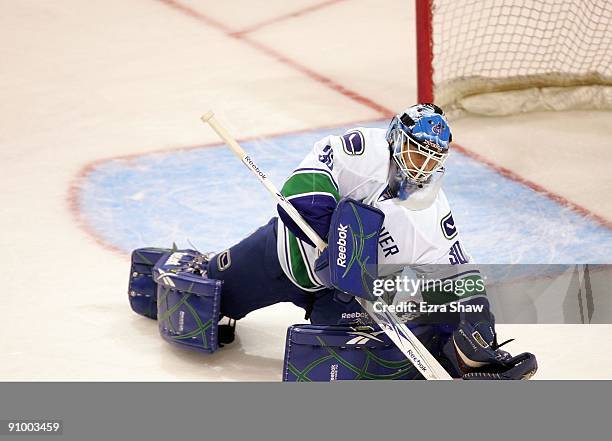 Goalie Andrew Raycroft of the Vancouver Canucks in action during their preseason game against the San Jose Sharks at the HP Pavilion on September 18,...