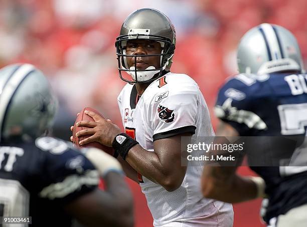 Quarterback Byron Leftwich of the Tampa Bay Buccaneers looks for a receiver against the Dallas Cowboys during the game at Raymond James Stadium on...