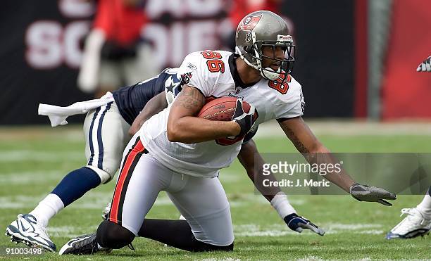 Tight end Jerramy Stevens of the Tampa Bay Buccaneers goes down after a catch against the Dallas Cowboys during the game at Raymond James Stadium on...