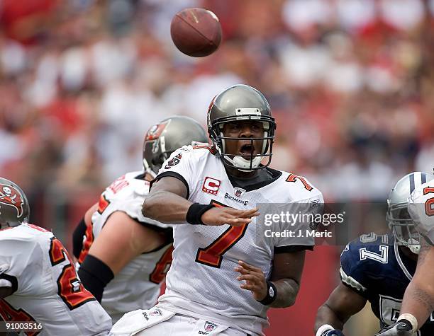 Quarterback Byron Leftwich of the Tampa Bay Buccaneers looks for a receiver against the Dallas Cowboys during the game at Raymond James Stadium on...