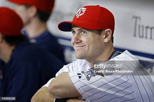 Justin Huber of the Minnesota Twins smiles in the dugout before the game against the Oakland Athletics on September 11, 2009 at the Metrodome in...