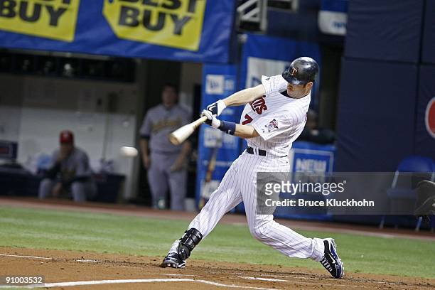 Joe Mauer of the Minnesota Twins bats against the Oakland Athletics on September 11, 2009 at the Metrodome in Minneapolis, Minnesota. The A's won...