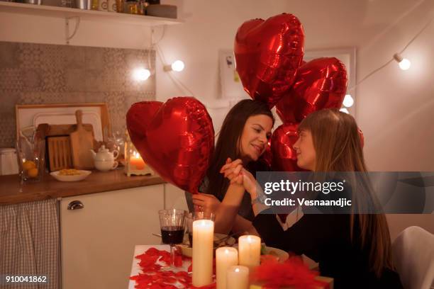 lesbian couple celebrating valentine's day - photos of lesbians kissing stock pictures, royalty-free photos & images