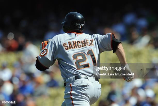 Freddy Sanchez of the San Francisco Giants runs to first base during the game against the Los Angeles Dodgers at Dodger Stadium on September 19, 2009...