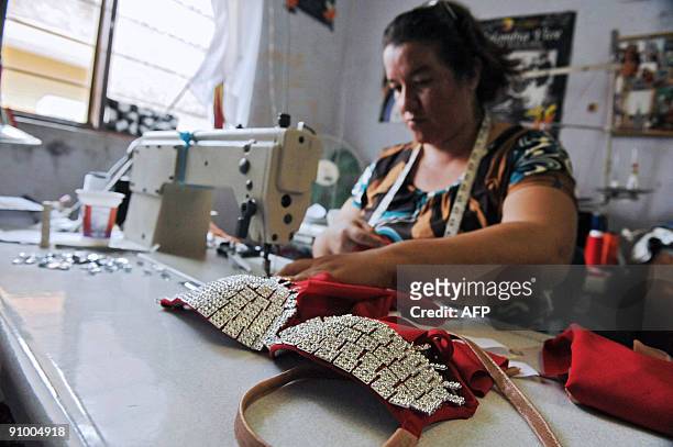 Colombian seamstress Maria del Pilar Duran makes a salsa dress, on September 20 in Cali, department of Valle del Cauca, Colombia. In the late 60s the...