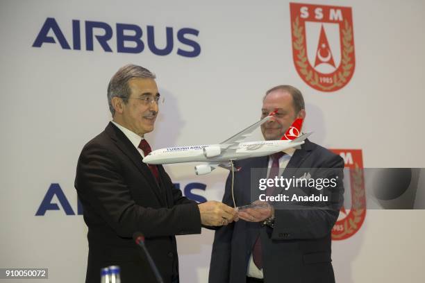 Ismail Demir , Undersecretary for Defense of Turkey Industry receives a model plane as a gift from Chairman of the Executive Board of Airbus Thierry...