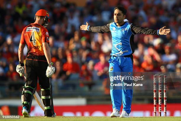 Rashid Khan of the Strikers celebrates the wicket of Hilton Cartwright of the Scorchers during the Big Bash League match between the Perth Scorchers...