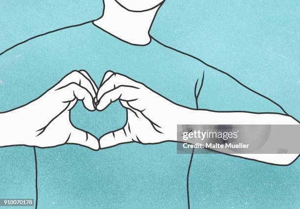 midsection of man making heart shape against blue background - hand on chest stock-fotos und bilder