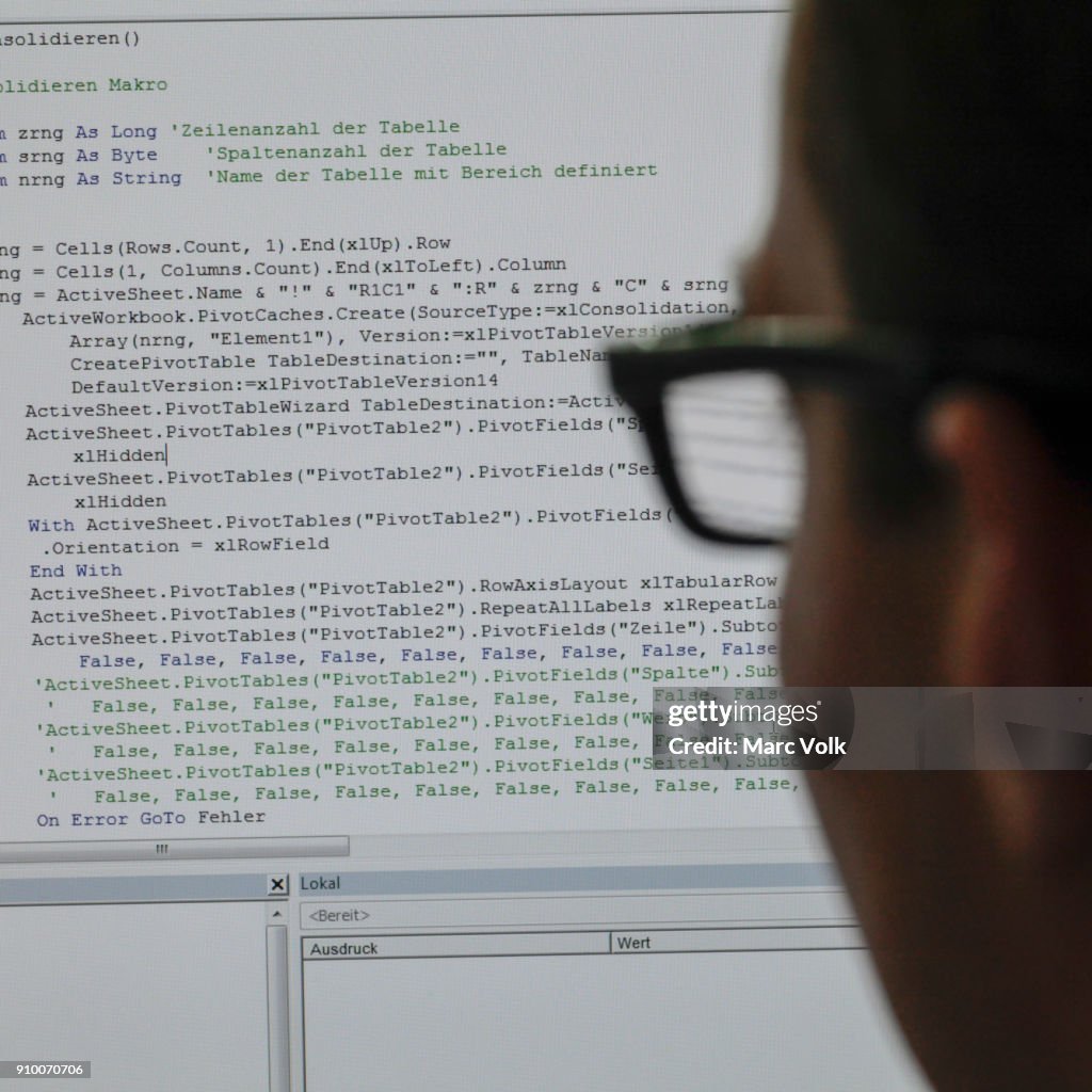 Close-up of person reading programming code on computer screen
