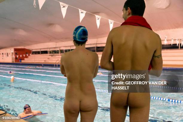 Graphic content / Nudists take part in a swimming lesson at the Roger Le Gall swimming pool in Paris on January 12, 2018. - Every week, some hours...