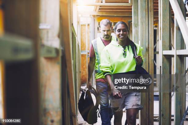 construction workers in australian in building site working and doing tasks. - business arrival stock pictures, royalty-free photos & images