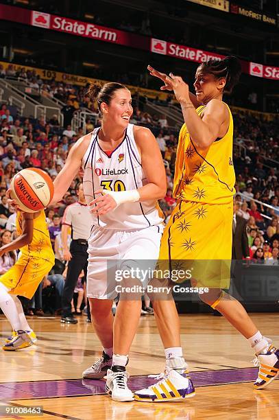 Nicole Ohlde of the Phoenix Mercury looks to pass against Candace Parker of the Los Angeles Sparks during the WNBA game on September 13, 2009 at US...