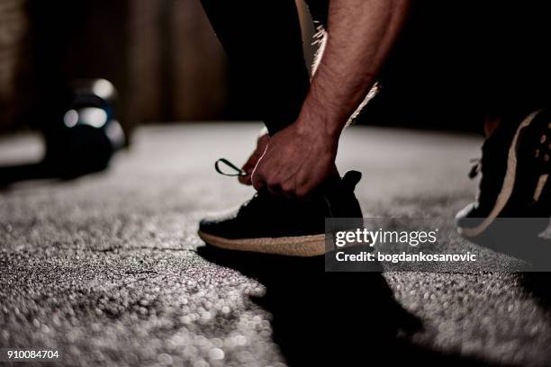 sports shoe - untied shoelace stock pictures, royalty-free photos & images