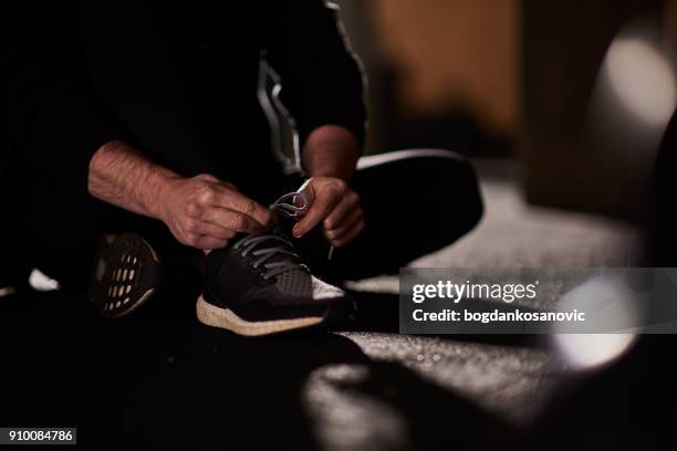 sports shoe - untied shoelace stock pictures, royalty-free photos & images