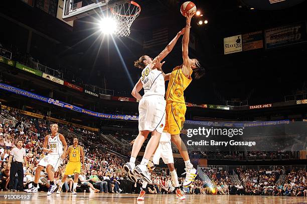 Nicole Ohlde of the Phoenix Mercury defends the shot by Candace Parker of the Los Angeles Sparks during the WNBA game on September 13, 2009 at US...