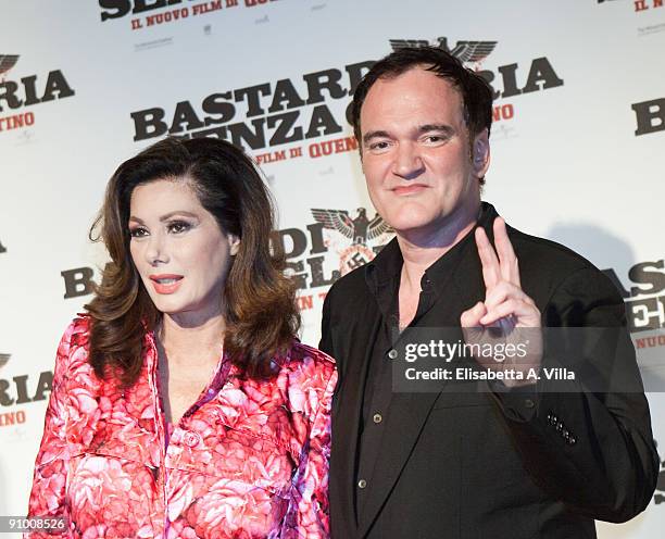 Director Quentin Tarantino and actress Edwige Fenech attend "Inglourious Basterds" Premiere at the Warner Cinema on September 21, 2009 in Rome, Italy.