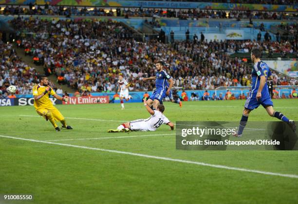 July 2014 - FIFA World Cup - Final - Germany v Argentina - Mario Gotze of Germany scores the winning goal as Ezequiel Garay and Martin Demichelis of...