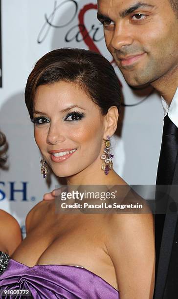 Actress Eva Longoria and Tony Parker pose as they arrive to attend the "Par Coeur Gala" dinner at the Hotel Meurice on September 21, 2009 in Paris,...