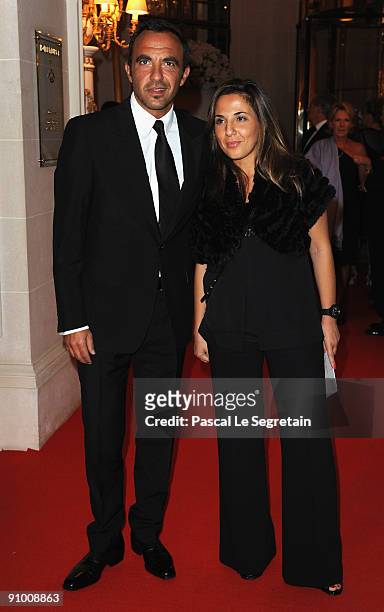 Nikos Aliagas poses with sister Maria as he arrives to attend the "Par Coeur Gala" dinner at the Hotel Meurice on September 21, 2009 in Paris, France.