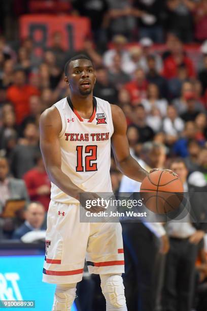 Keenan Evans of the Texas Tech Red Raiders brings the ball up court during the game between the Texas Tech Red Raiders and the Oklahoma State Cowboys...