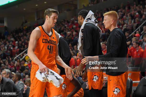 Mitchell Solomon of the Oklahoma State Cowboys is congratulated by teammates during the game against the Texas Tech Red Raiders on January 23, 2018...