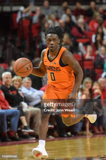 Brandon Averette of the Oklahoma State Cowboys brings the ball up court during the game against the Texas Tech Red Raiders on January 23, 2018 at...