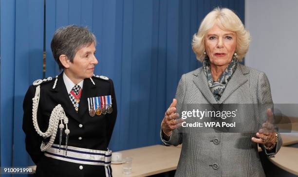 Camilla, Duchess of Cornwall speaks as Metropolitan Police Commissioner Cressida Dick looks on as she visits the Metropolitan Police Service Base to...