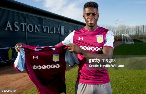 New signing Axel Tuanzebe of Aston Villa poses for a picture at the club's training ground at Bodymoor Heath on January 25, 2018 in Birmingham,...