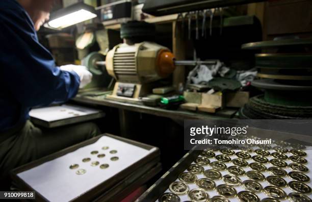 Worker polishes a Gold Bitcoin Ver 2.0 gold medal produced by Sakamoto Metal at a workshop on January 25, 2018 in Tokyo, Japan. Sakamoto Metal, a...