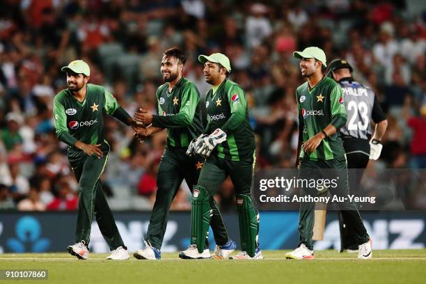 Faheem Ashraf of Pakistan celebrates with teammates for the wicket of Glenn Phillips of New Zealand during the International Twenty20 match between...