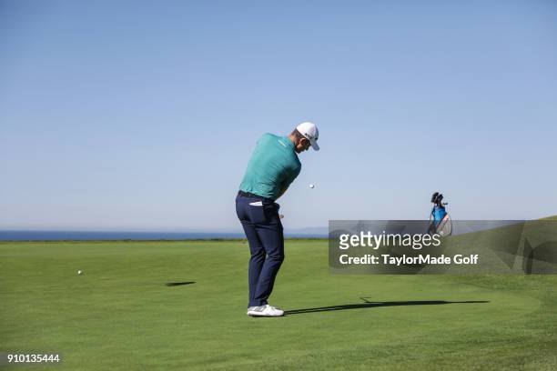 Justin Rose chips off the green on the South Course at the Farmers Insurance Open golf tournament on January 24, 2018 in San Diego, California.