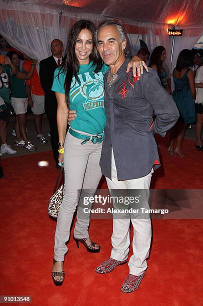 Lisa Pliner and Donald Pliner arrive at the orange carpet for the Miami Dolphins game at Landshark Stadium on September 21, 2009 in Miami, Florida.