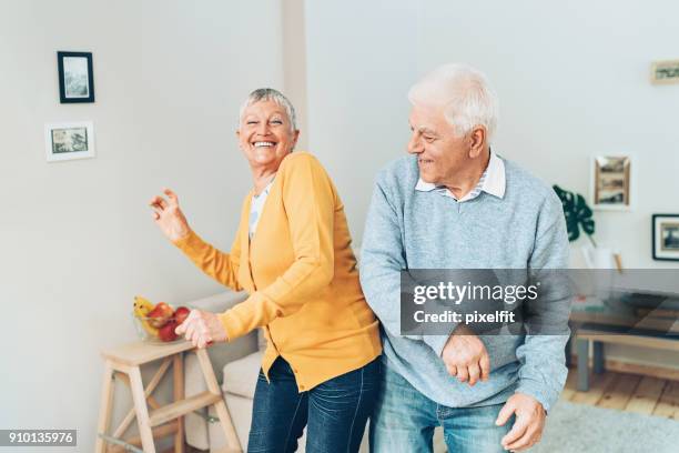 always having fun together - active seniors dancing stock pictures, royalty-free photos & images