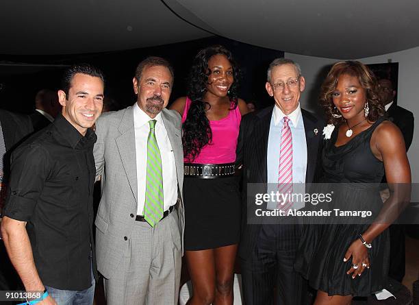 Helio Castroneves, Jorge Perez, Venus Williams, Stephen Ross and Serena Williams pose at the Ocean Drive Club prior to the Miami Dolphins game at...