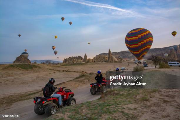 hot air ballooning near goreme town in cappadocia,nevsehir,central anatolia of turkey - göreme stock pictures, royalty-free photos & images