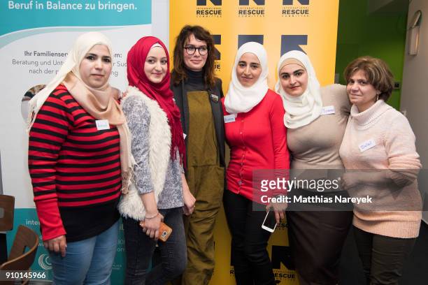 Actress Lena Headey poses for a photo with refugee woman from Syria on January 25, 2018 in Berlin, Germany. The Federal Government Commissioner for...
