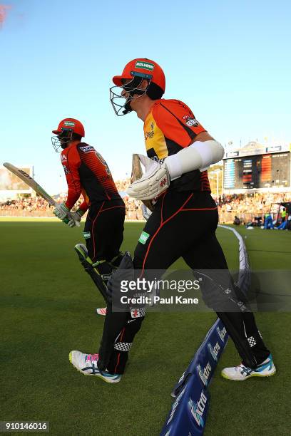 Sam Whiteman and Michael Klinger of the Scorchers walk out to bat during the Big Bash League match between the Perth Scorchers and the Adelaide...