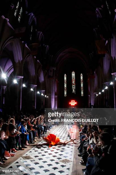 French dancer and choreographer Marie-Agnès Gillot performs as a model presents a creation for Maison Rabih Kayrouz during the 2018 spring/summer...