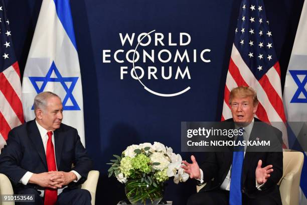 President Donald Trump speaks with Israel's Prime Minister Benjamin Netanyahu during a bilateral meeting on the sidelines of the World Economic Forum...