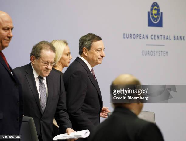 Mario Draghi, president of the European Central Bank , center, Christine Graeff, director general for communications at the European Central Bank ,...