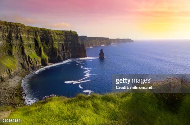 cliffs of moher at colourful sunset co. clare, ireland - ireland photos et images de collection