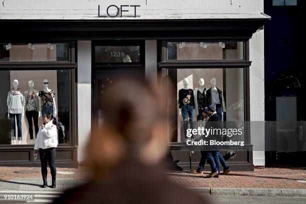 Pedestrians pass in front of an Ann Taylor Inc. Loft store in the Georgetown neighborhood of Washington, D.C., U.S., on Wednesday, Jan. 24, 2018....