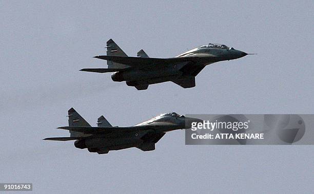 Iran's Mig-29 fighter jets fly during an annual military parade which marks Iran's eight-year war with Iraq, in the capital Tehran on September 22,...