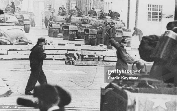 Russian and American tanks face each other at the Friedrichstrasse checkpoint in Berlin, during the construction of the Berlin Wall, 28th October...