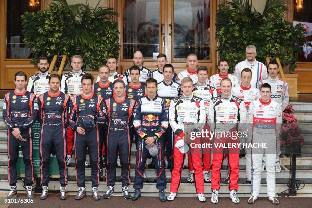 Drivers pose prior to the start of the season-opening Monte Carlo Rally on January 25, 2018 at the Monte Carlo's Casino Square. First row From left :...