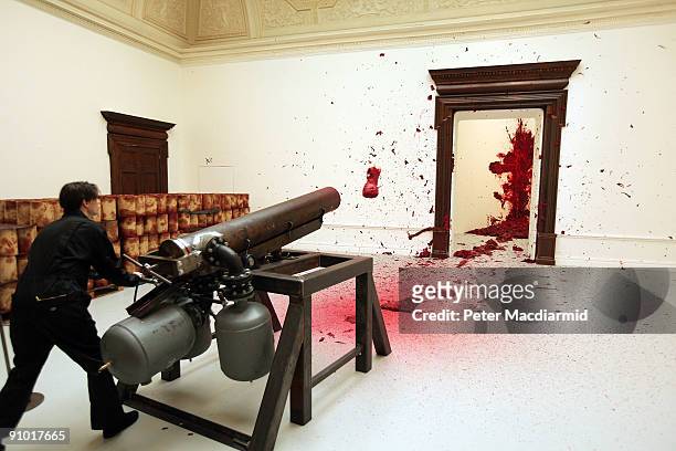 Anish Kapoor's sculpture 'Shooting into the Corner' is displayed as it fires a wax canon ball in The Royal Academy on September 22, 2009 in London....