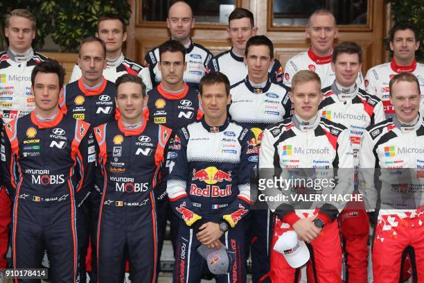 Drivers pose prior to the start of the season-opening Monte Carlo Rally on January 25, 2018 at the Monte Carlo's Casino Square. First row From left :...