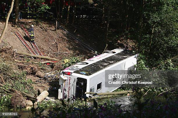 Rescue services work on the scene of a bus crash on September 22, 2009 in Dahlerau near Radevormwald, Germany. Five people were killed and seven...