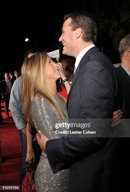 Actress Jennifer Aniston and Scott Stuber arrive on the red carpet at the Los Angeles premiere of "Love Happens" at the Mann's Village Theatre on...