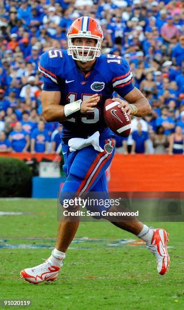 Tim Tebow of the Florida Gators scrambles for yardage during the game against the Tennessee Volunteers at Ben Hill Griffin Stadium on September 19,...